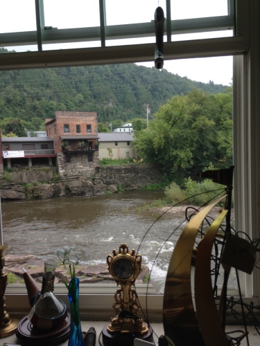 river out a window,antiques,rushing water,riverbank,